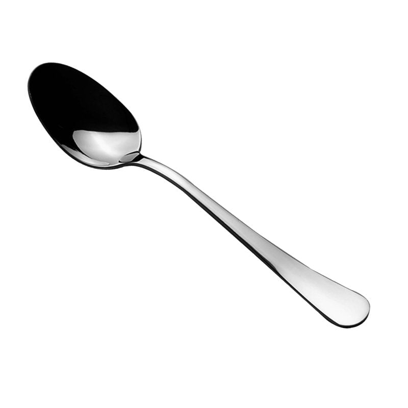 Connoisseur Curve dessert spoon on white, deep polished bowl at the upper left and a handle sweeping out to a broad rounded end