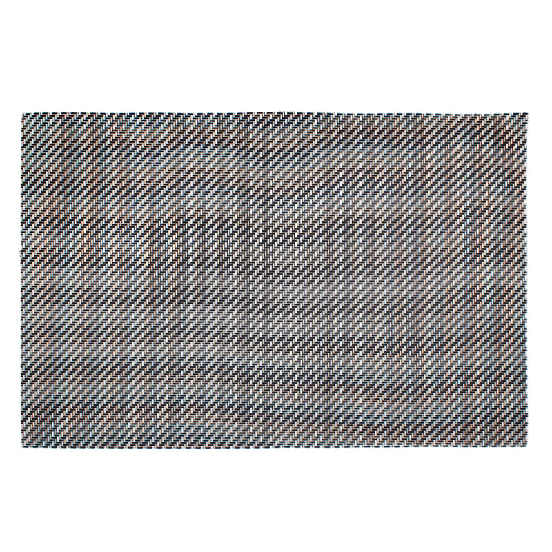 Connoisseur metallic woven PVC placemat laid flat on white, dark diagonal weave flecked with silver