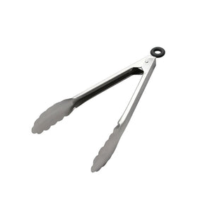 Connoisseur stainless steel serving tongs open on white, scalloped heads at the front and a black rubber ring at the hinge end