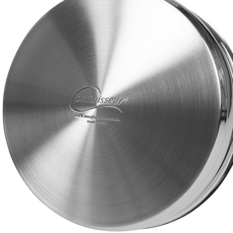 Brushed stainless base of a Connoisseur pan engraved with the Connoisseur logo and the Weatherdon web address