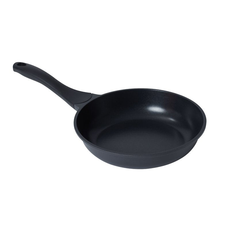 Connoisseur Xylo 24 cm die-cast frypan with a black ceramic non-stick interior and a black handle, on a white background