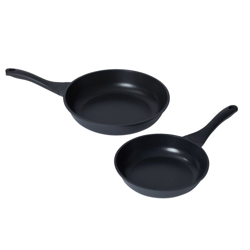 Two Connoisseur Xylo frypans of different sizes shown together, both black with black handles