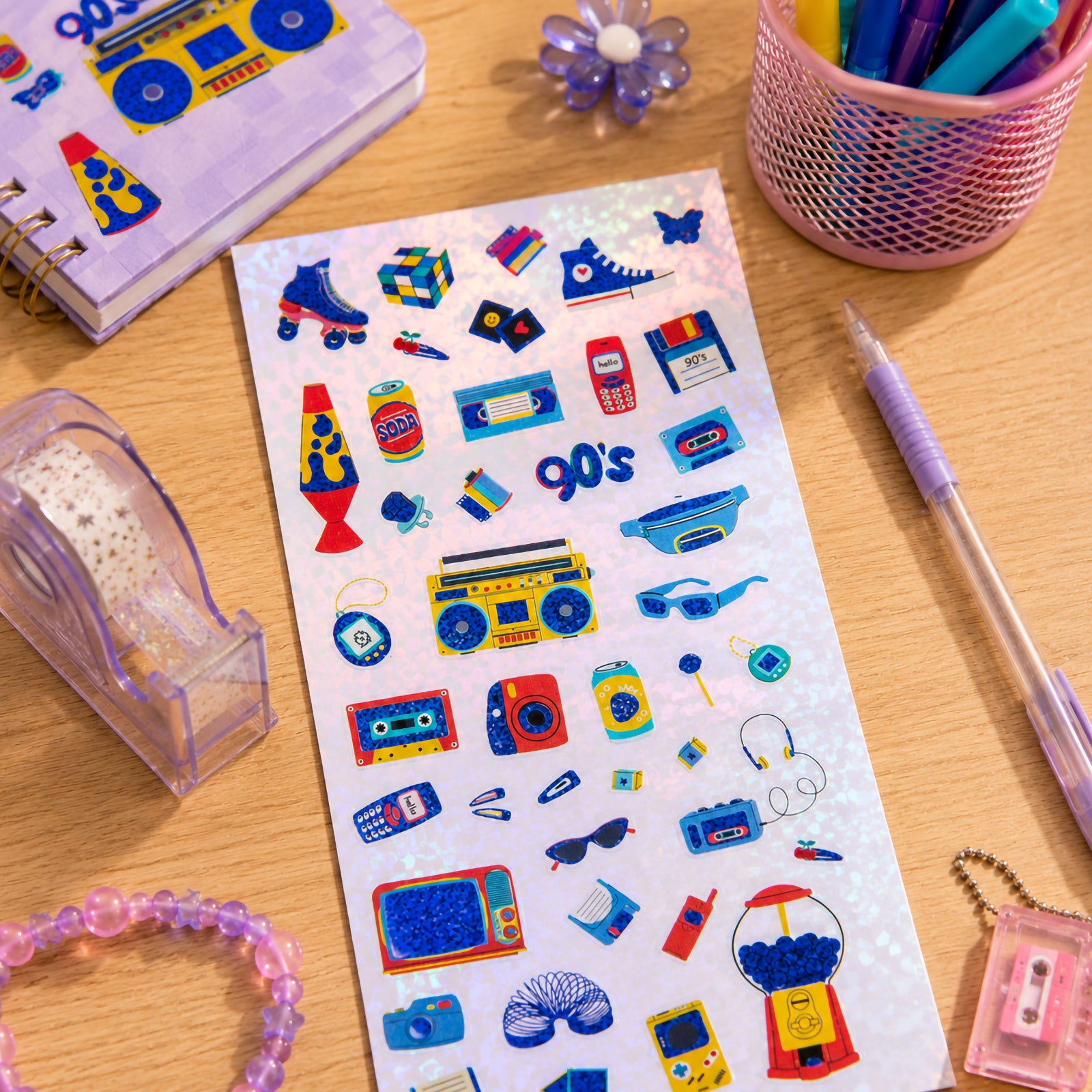 Full sticker sheet displaying all 42 holographic retro themed stickers. Designs include vintage technology, music players, gaming devices, cameras, cassette tapes, roller skates, boom boxes and nostalgic pop culture icons.