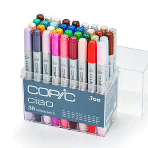 Copic Ciao 36 colours set E in an open clear acrylic case with the lid beside it, showing brown, teal, blue, pink and neutral caps