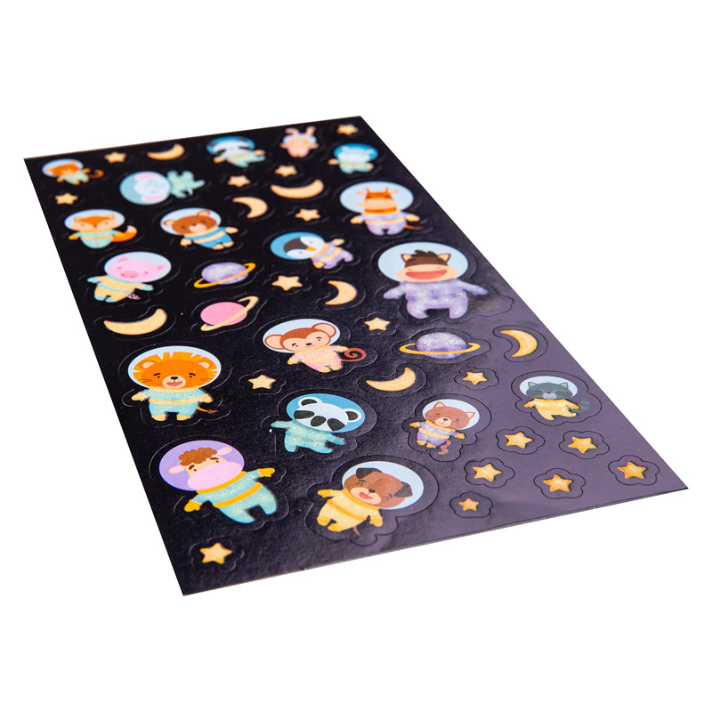 Angled close up of the Cosmic Critters sticker sheet highlighting the raised sticker design and colourful glow elements. The collection features animal astronauts exploring a playful galaxy.