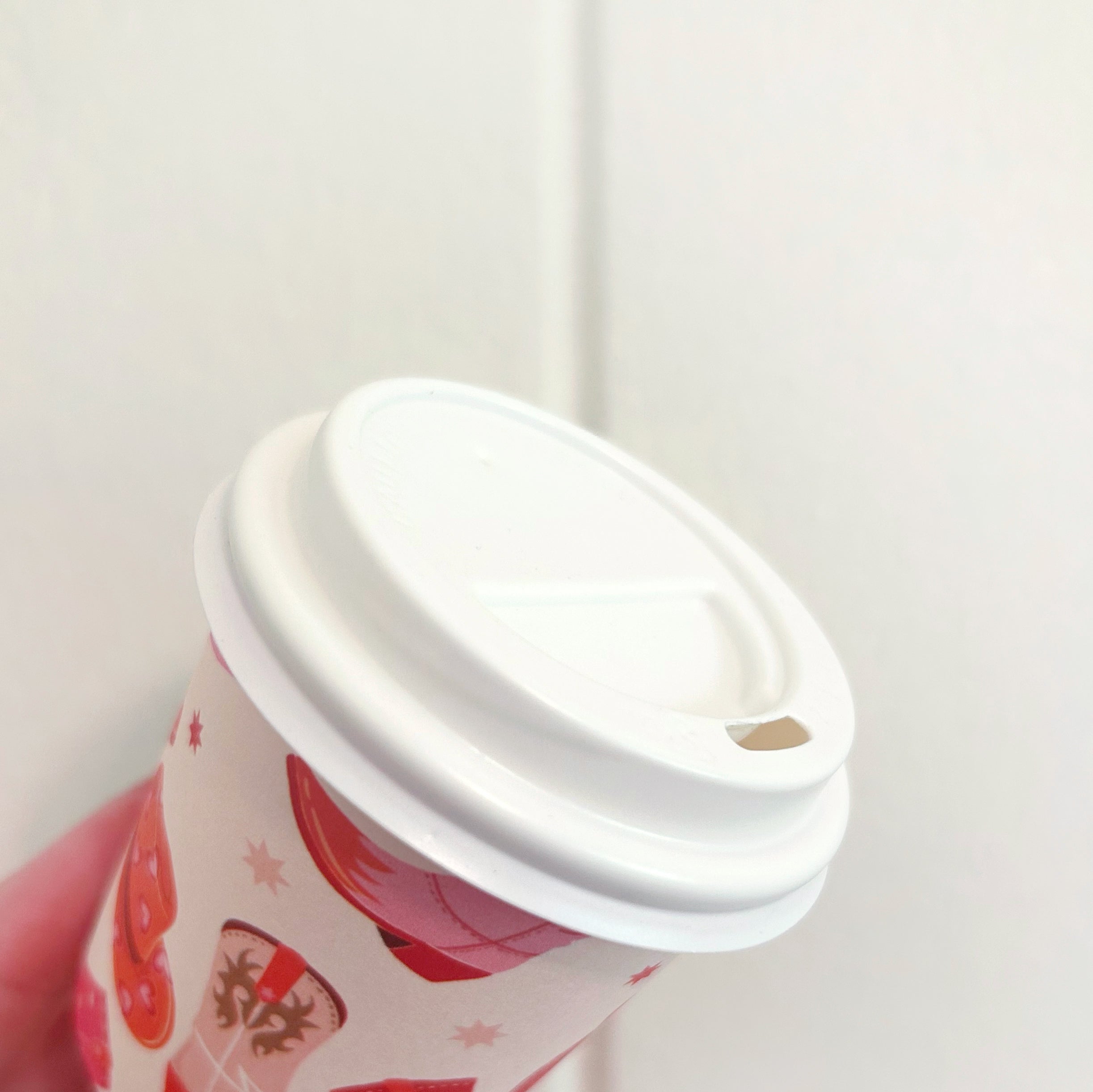 Small white polypropylene lid for 4oz babycino and espresso cups shown on a white background