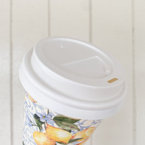 Creative Cafe Co white PP hot lid fitted to a printed takeaway coffee cup, angled view showing the sip opening