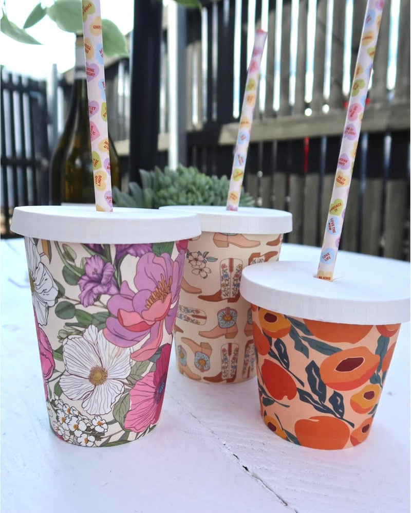 Home compostable paper cold lid shown with a paper straw through the centre hole