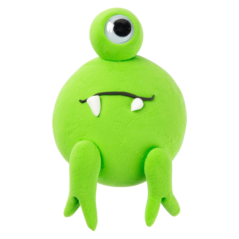 Front facing view of a handcrafted one eyed creature created using fluoro green clay with white and black detailing. The image demonstrates how the clay can be shaped into fun characters, imaginative models and creative educational projects.
