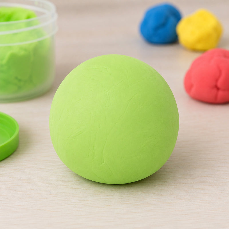 Playful one eyed monster character sculpted from fluoro green CreativeClay displayed on a craft table. The detailed figure showcases the clay's flexibility, smooth finish and ability to create imaginative creatures, fantasy characters and decorative models.