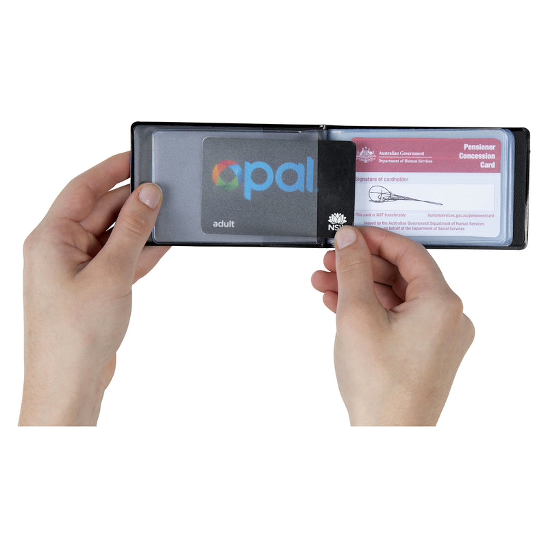 Hands holding the open Cumberland Business Card File with clear internal sleeves containing standard sized transport and concession cards, demonstrating the practical storage capacity and easy card access.