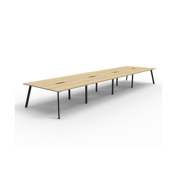 Rapidline Eternity back to back 8 person workstation in Natural Oak with a Black Satin base, no screen, wide angled studio view on a white background