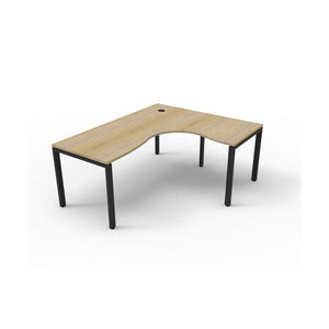 Rapidline Deluxe Infinity corner workstation, Natural Oak top on a black satin profile leg base, wider three quarter view with cable hole visible