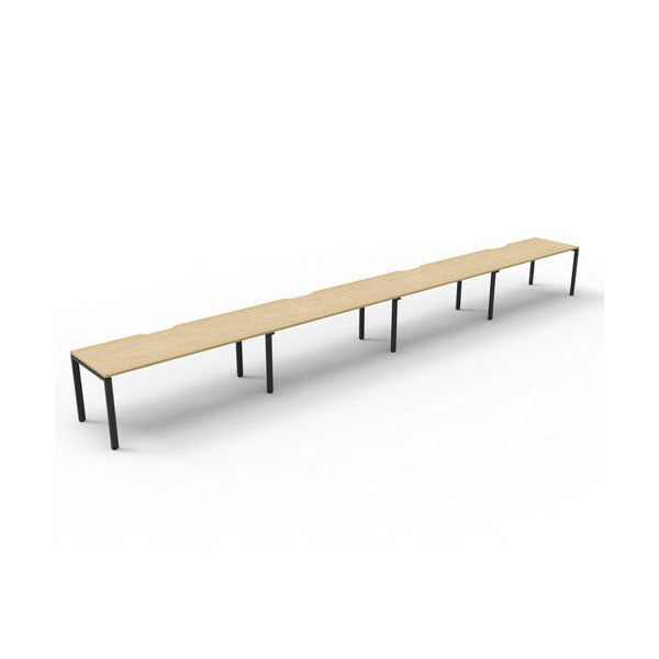 Rapidline Deluxe Infinity single sided profile leg workstation, pod of four desks with Natural Oak tops, Black Satin base, angled view from the front left on a white background