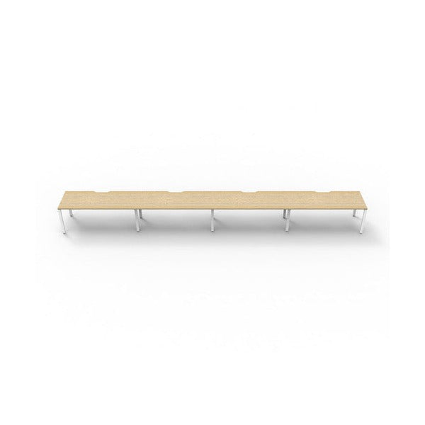 Rapidline Deluxe Infinity single sided profile leg workstation, pod of four desks with Natural Oak tops, White Satin base, front view at desk height on a white background