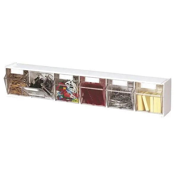 White desk organizer with compartments holding office supplies on a white background
