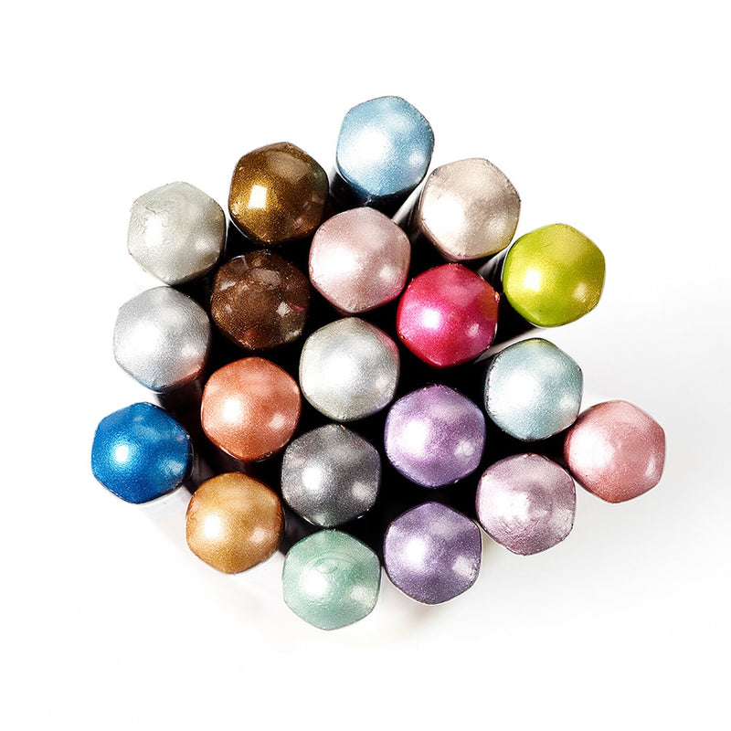 Top-down view of the hexagonal ends of the 20 Derwent Metallic pencils from the gift set, grouped together to show each metallic colour