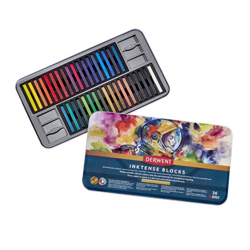 Derwent Inktense Blocks Tin of 36 opened, a wide tray of coloured blocks in two rows with the astronaut-artwork lid in front