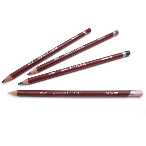 Derwent Academy Pastel Pencil Burnt Carmine Box of 6. Six Derwent Burnt Carmine pastel pencils fanned out on white background.