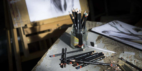 Derwent Tinted Charcoal Pencil Driftwood Box of 6. Artist using Derwent Tinted Charcoal Driftwood pencil to sketch on paper.