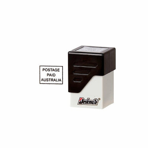 Deskmate pre-inked Postage Paid Australia office stamp in black with protective cap removed showing die face