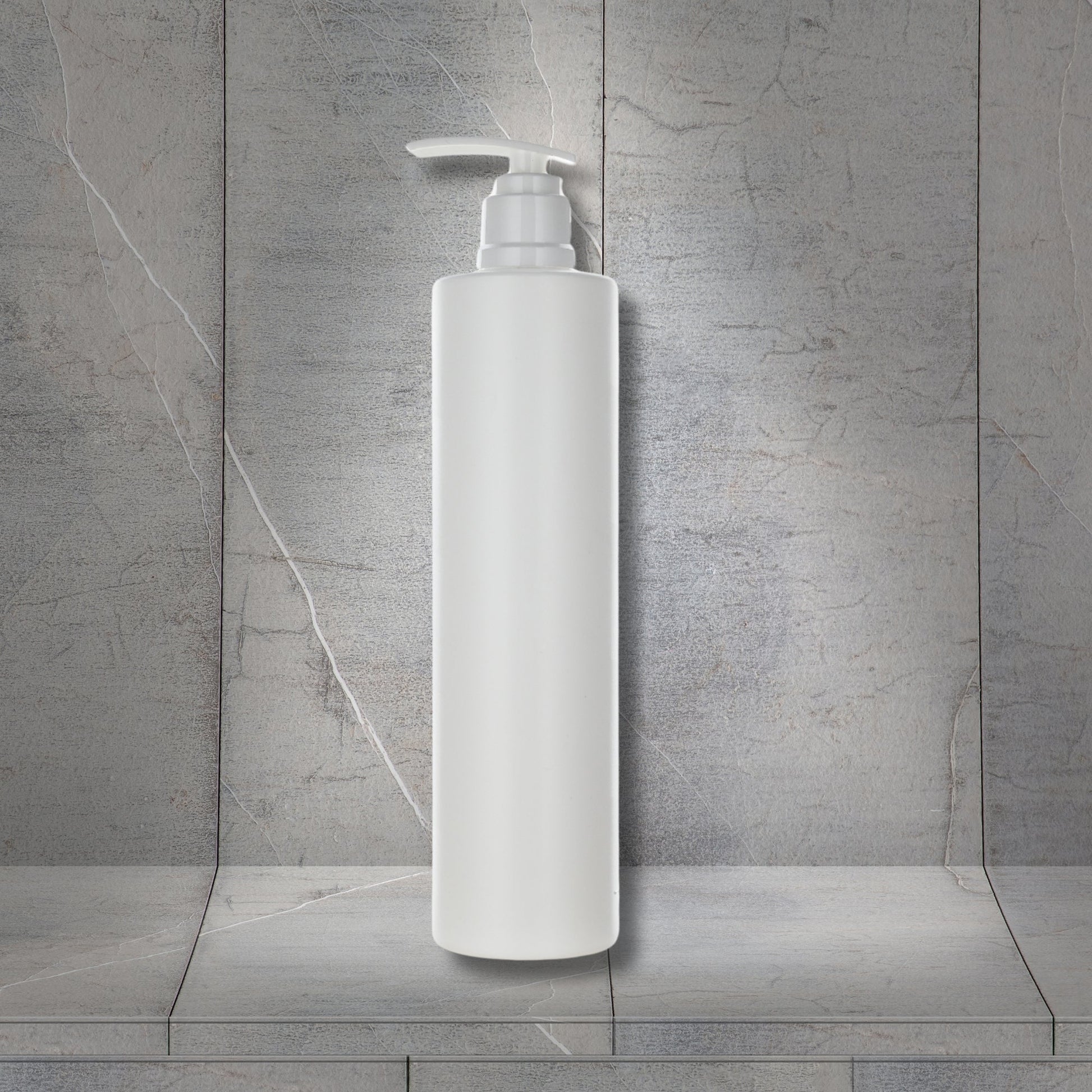 Dolphy refillable soap and shampoo dispenser in white ABS, wall mounted showing the tall slim body and push pump dispensing head