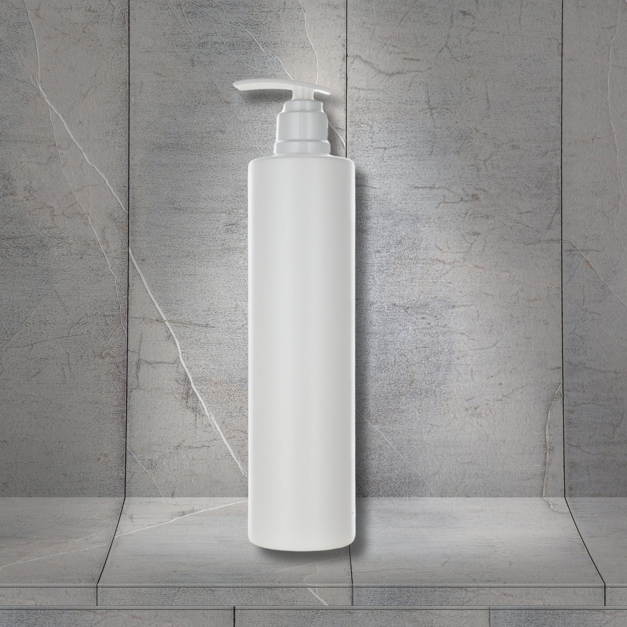 Dolphy refillable soap and shampoo dispenser in white ABS, wall mounted showing the tall slim body and push pump dispensing head