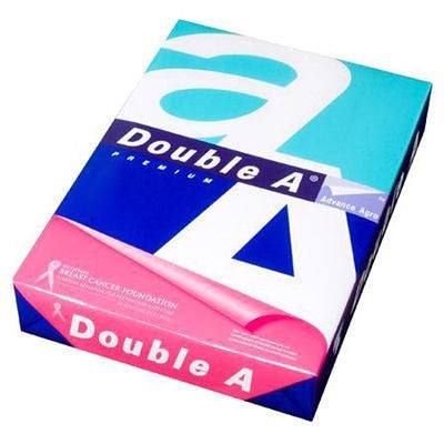 Angled view of a wrapped ream of Double A Premium A4 80gsm copy paper lying flat, showing the Advance Agro branding on the spine and the pink National Breast Cancer Foundation band across the front corner
