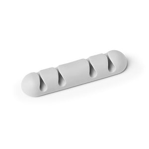 Durable 504010 Cavoline cable clip in light grey, a rounded soft plastic bar with four cable channels on white