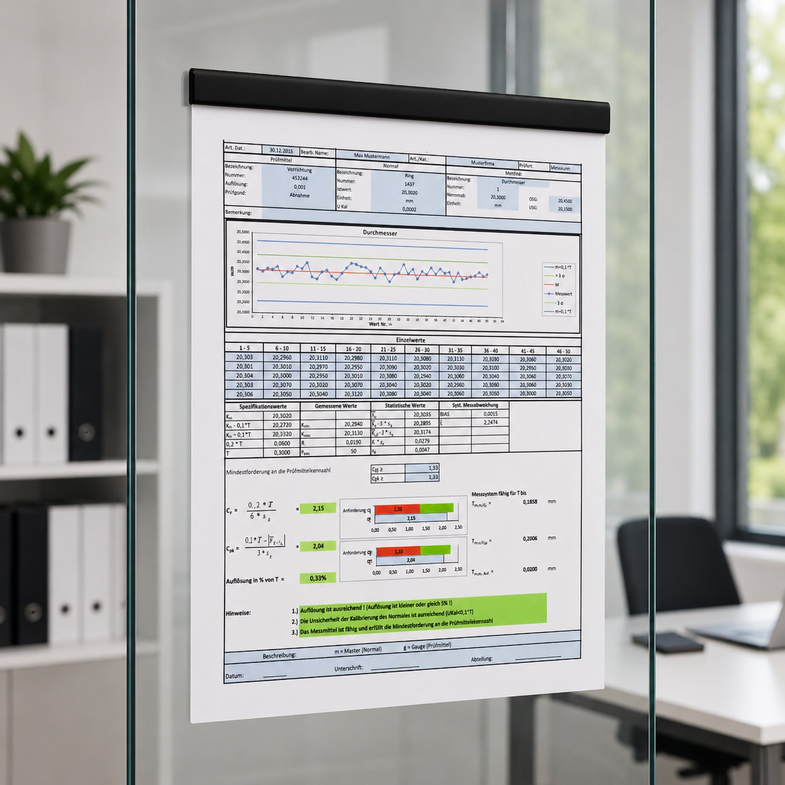 Durable Durafix black magnetic strip mounted on a glass office partition holding an A4 technical report. The image showcases the clean bubble free installation, premium black finish and professional presentation in a modern meeting room.