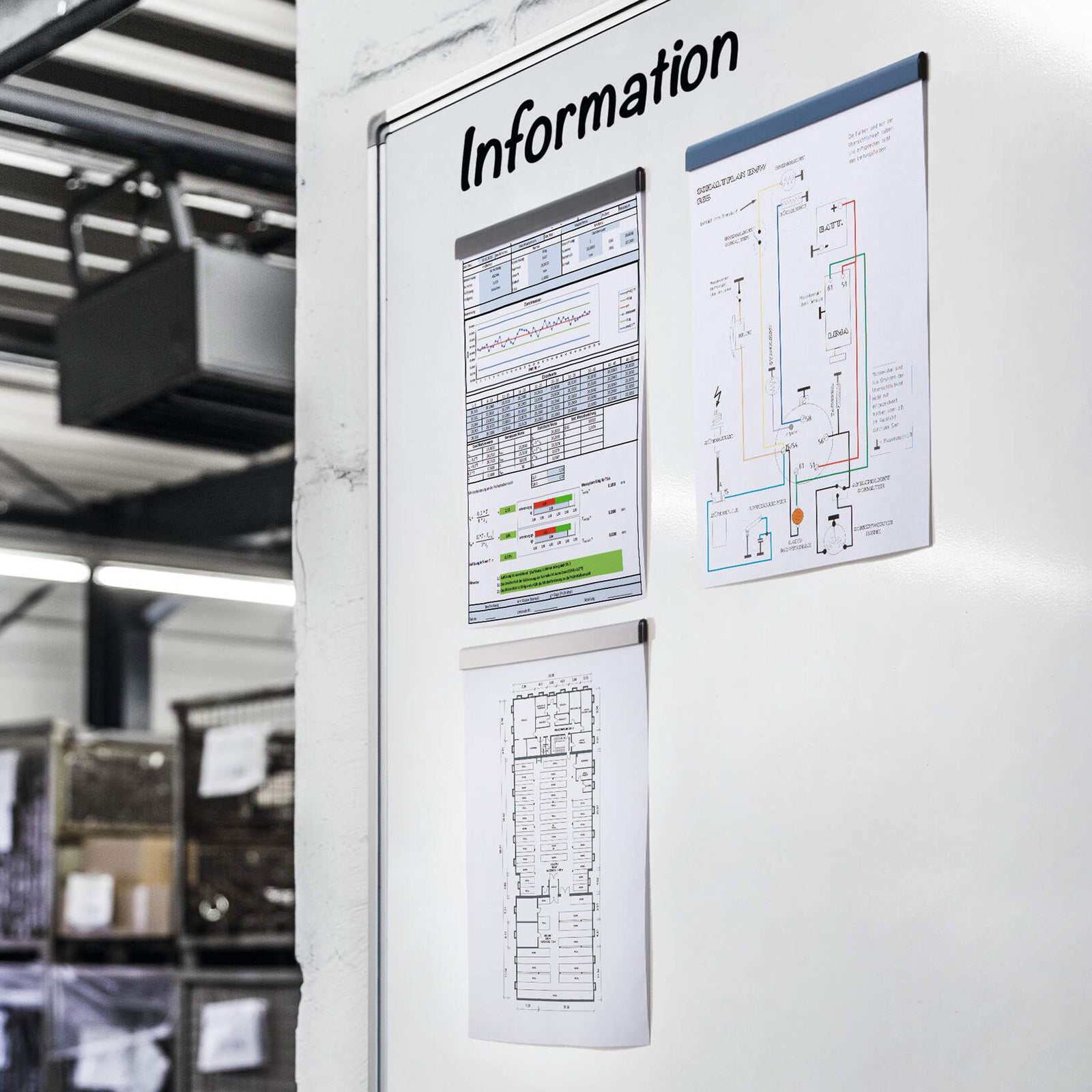 Black Durable Durafix magnetic strips securing technical drawings, reports and floor plans to a workplace information board in an industrial facility. The image highlights their suitability for warehouses, manufacturing sites and operational communication boards.