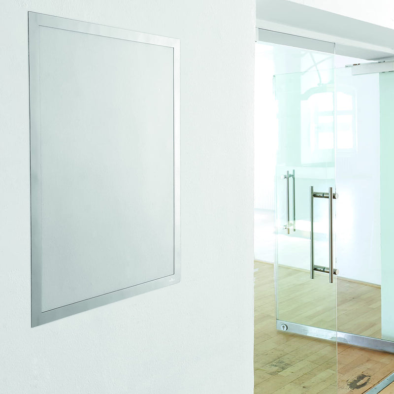 The Durable DURAFRAME Poster 50 x 70cm Silver mounted on a clean interior wall with no poster inserted, highlighting the slim silver border and transparent display window ready for promotional or informational graphics.