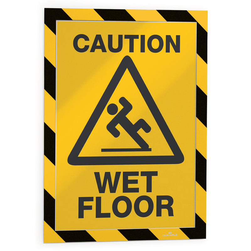 Front product view displaying a wet floor warning poster inside the Durable DURAFRAME Security A4 frame. The bold border increases visibility for temporary hazard alerts in public and workplace settings.
