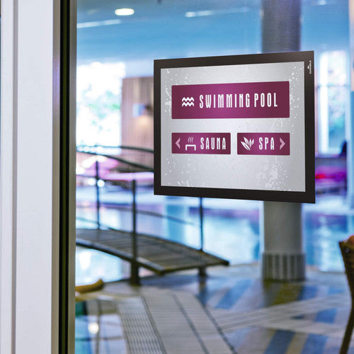 Durable Duraframe A4 black sign holder in reception area used for room identification signage