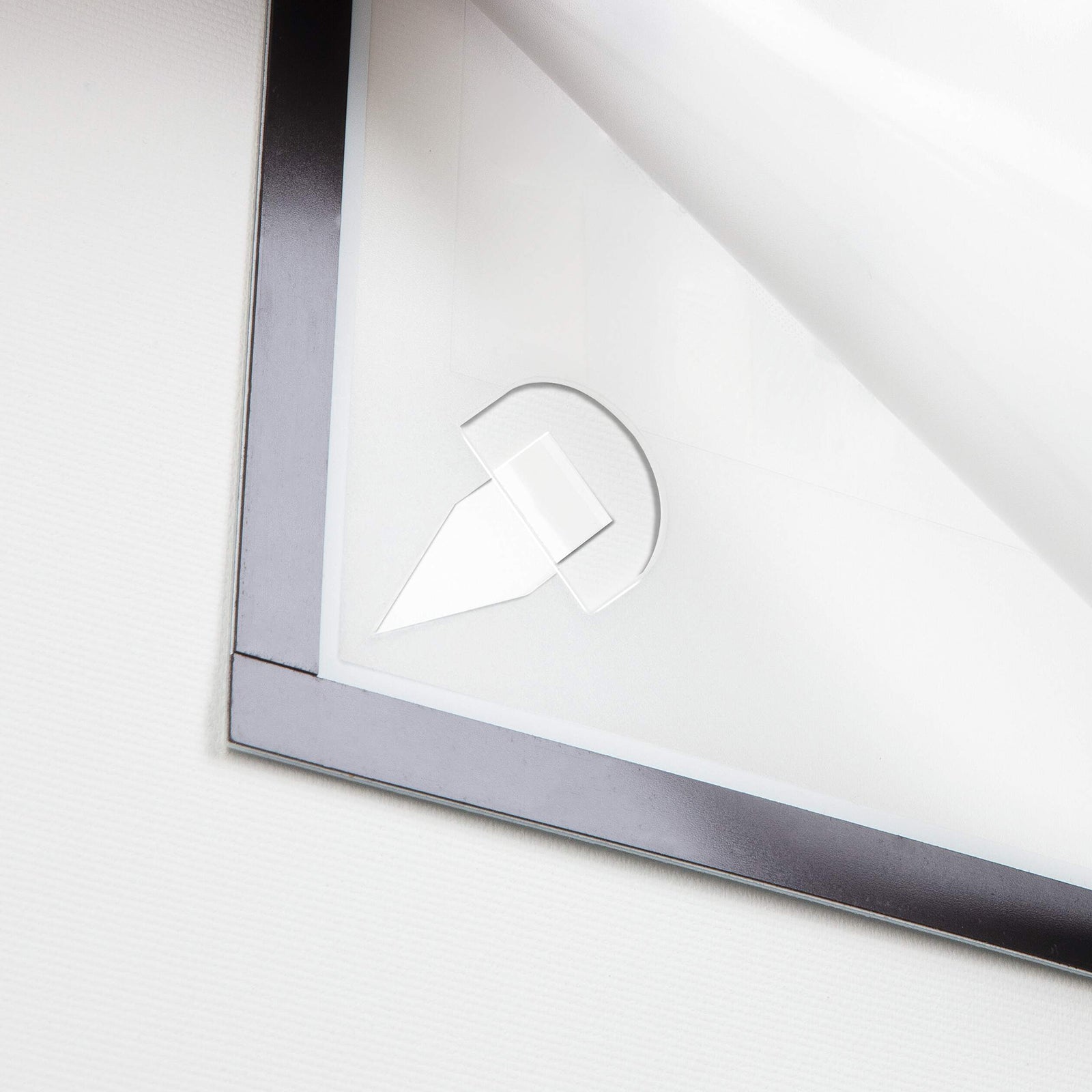 Close up detail of the Durable DURAFRAME Wallpaper A3 Silver showing one corner of the fold back magnetic front and removable adhesive strip. The image highlights the clean finishing, secure mounting method and damage free removal designed for sensitive wall surfaces.