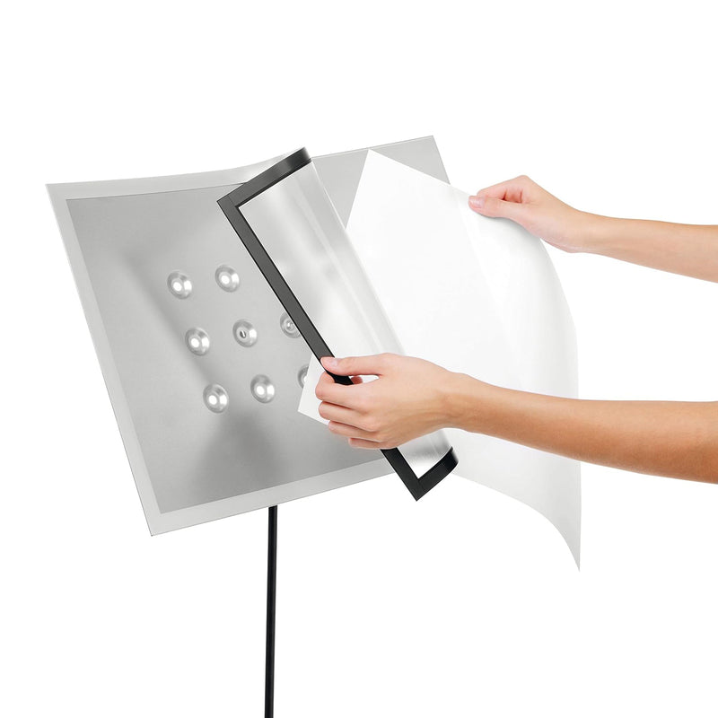 Demonstration of the detachable DURAFRAME Magnetic frame being removed from the display panel for fast document replacement, illustrating the quick and convenient update process without tools.