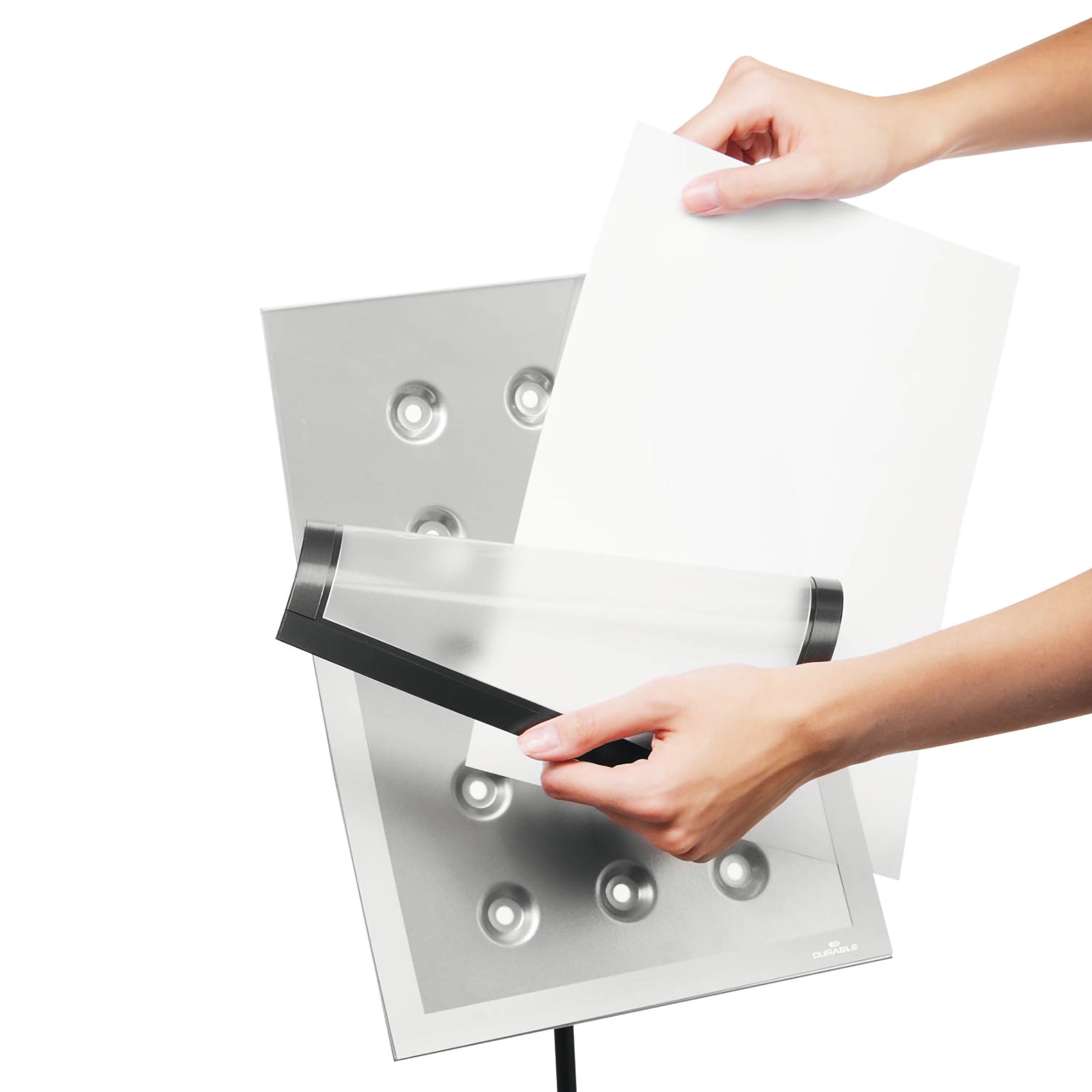 Hands inserting an A4 document into the detachable DURAFRAME Magnetic display frame on the Durable Duraview Floor Stand, demonstrating the simple and efficient document replacement process.