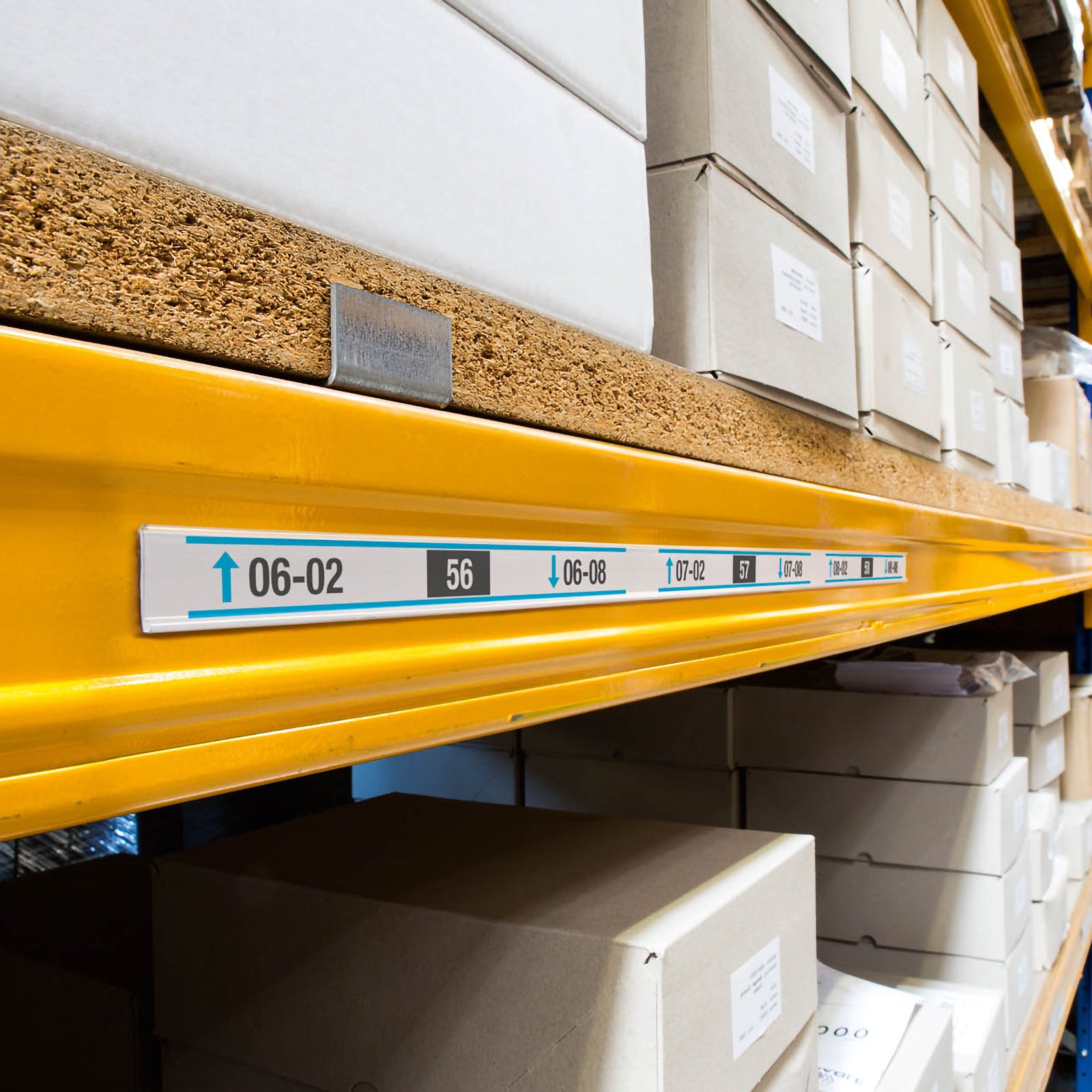 Warehouse shelving fitted with multiple Durable Scanfix Self Adhesive Label Strips displaying printed rack location labels and barcode information for organised inventory management.