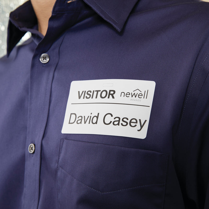 Visitor name badge label printed on 54 x 101mm Dymo label worn on a shirt