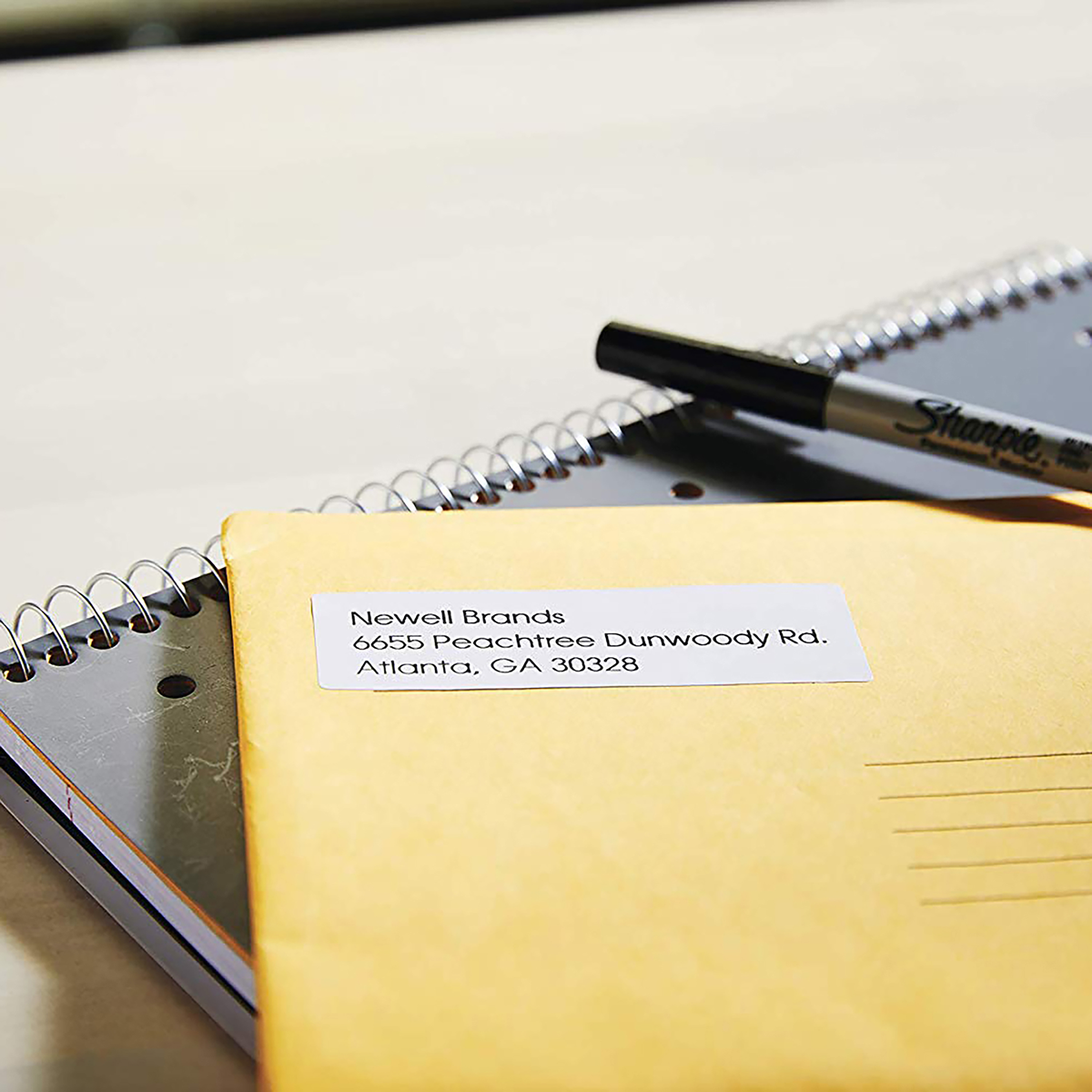 19 x 51mm Dymo label printed with a return address on a yellow envelope