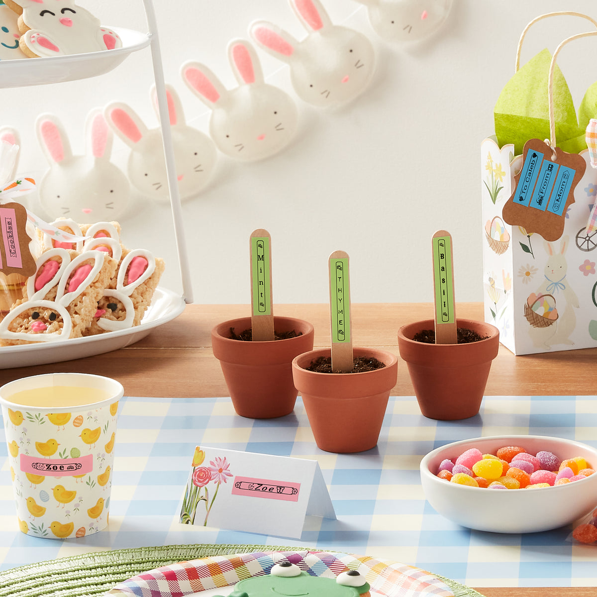 Party table with pastel LetraTag labels on plant markers and treats