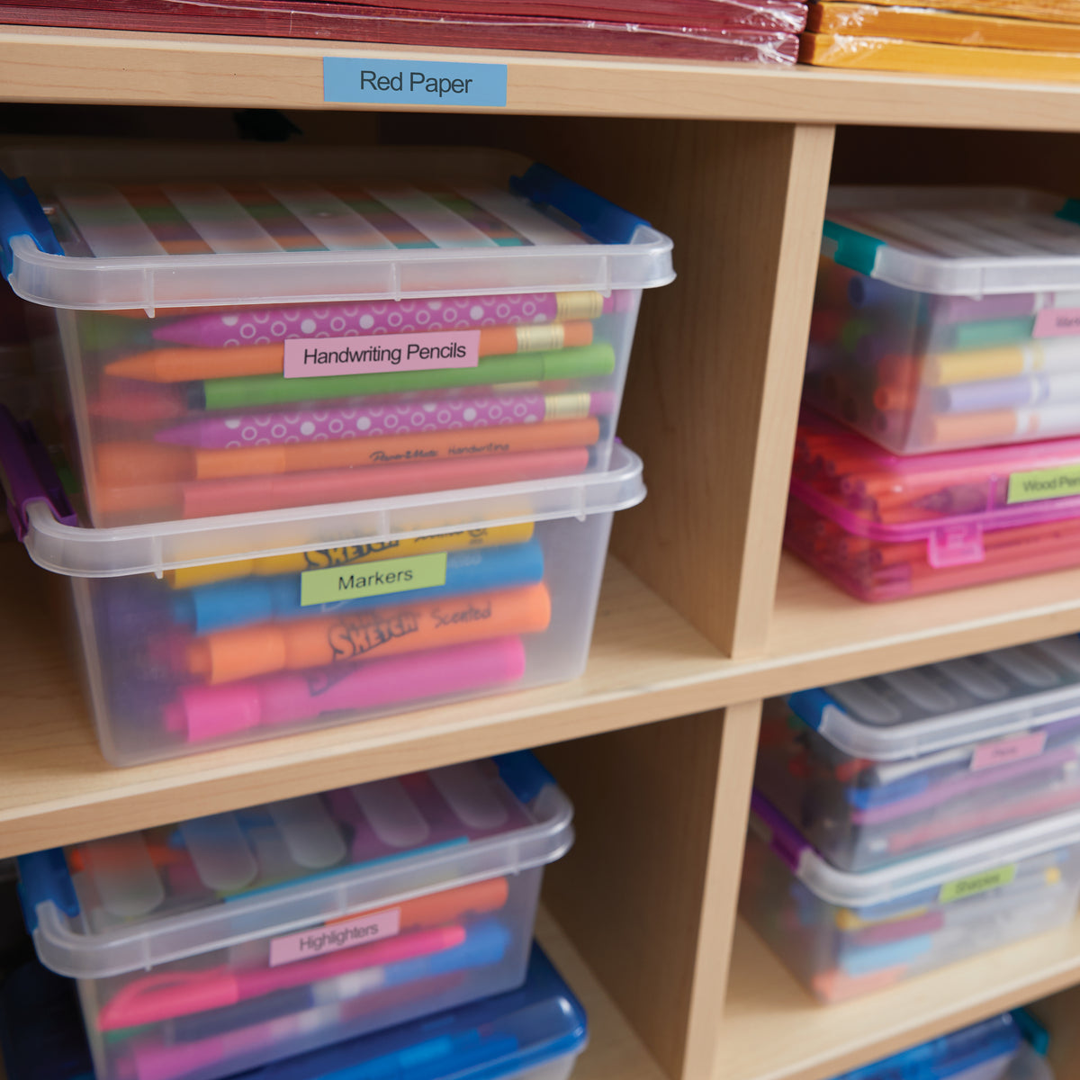 Craft storage tubs labelled with pastel LetraTag tape