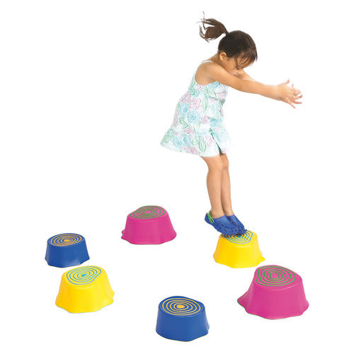Child stepping across EDX Education Step-a-Stumps during a physical education activity