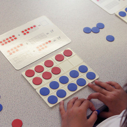 Ten frames and counters arranged to demonstrate number recognition activity