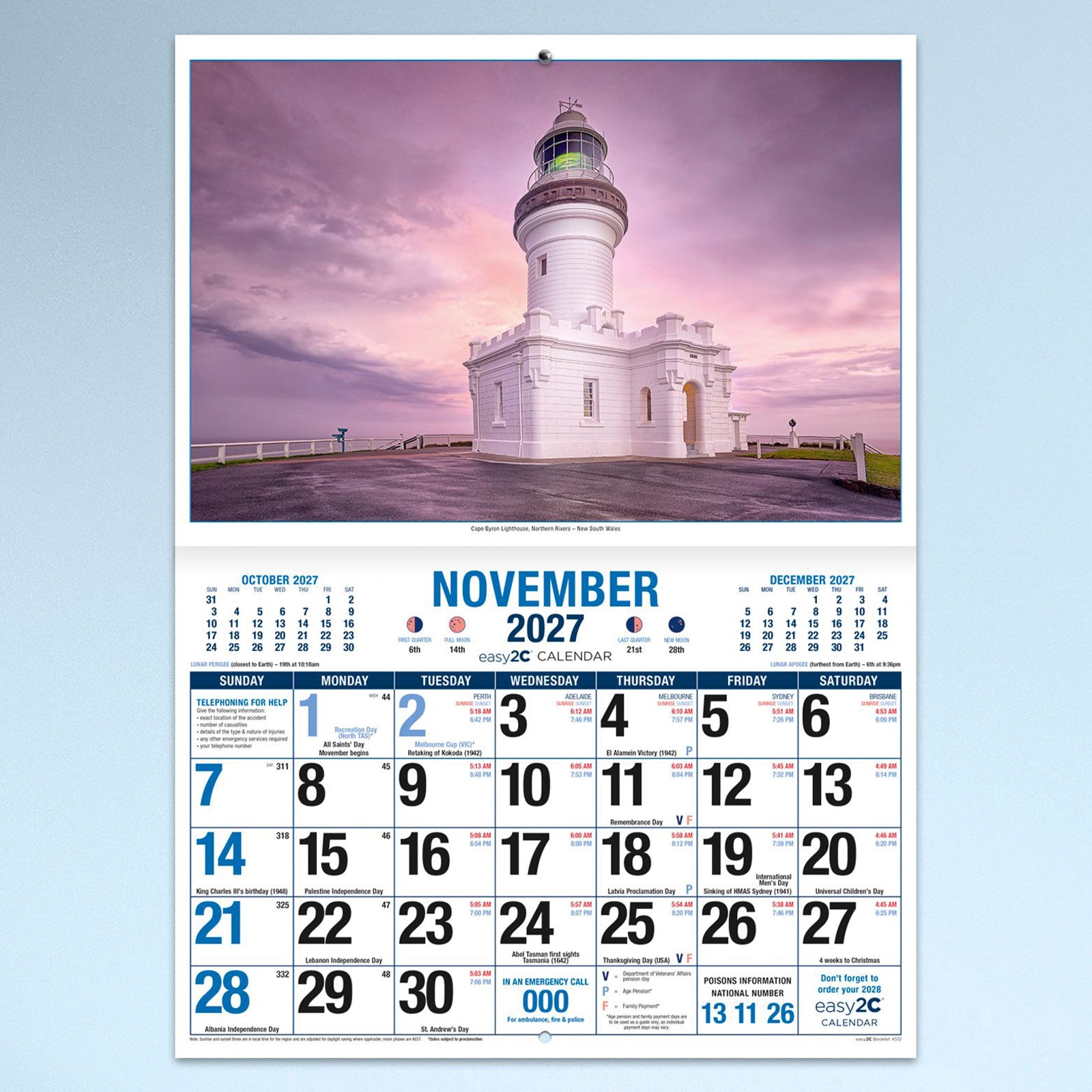 November calendar page featuring the Cape Byron Lighthouse in New South Wales beneath a colourful sunset sky, combined with a large monthly planner and reference calendars for surrounding months.