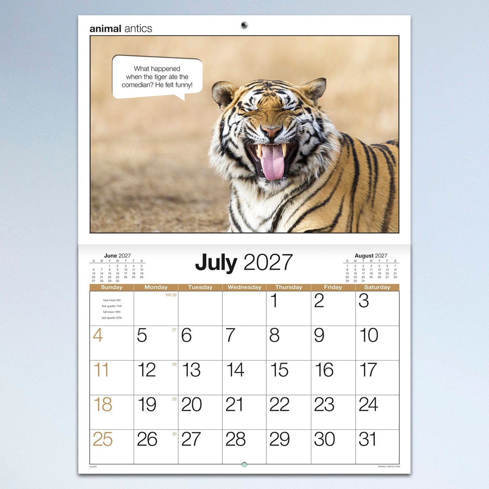 The July calendar page featuring a laughing tiger alongside a humorous caption with a large monthly calendar grid beneath, creating an enjoyable planning experience.
