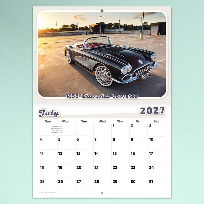 July page featuring a glossy black 1958 Chevrolet Corvette photographed during golden hour. The retro themed monthly layout blends premium automotive photography with practical planning space.