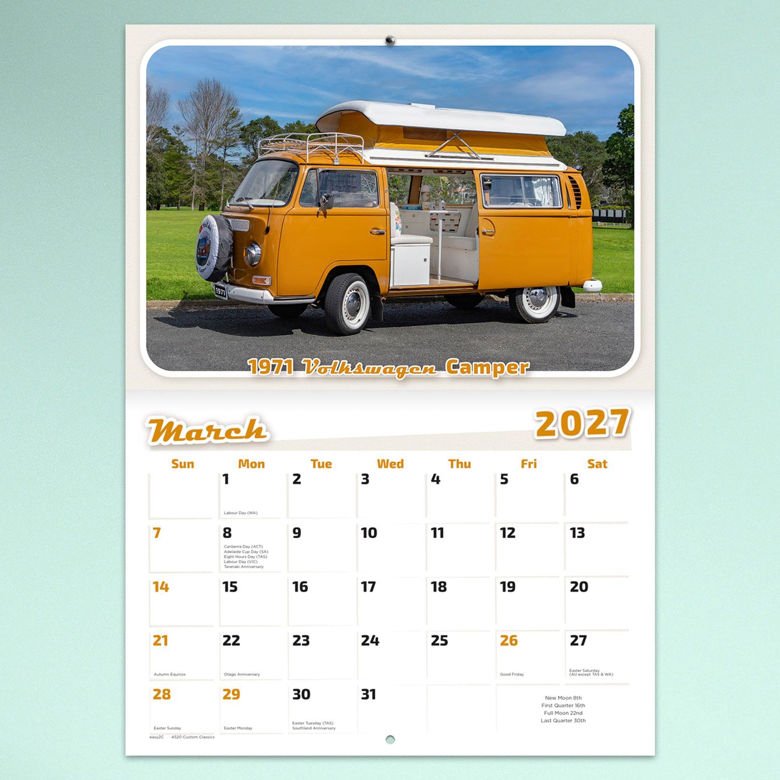 March calendar page featuring a bright yellow 1971 Volkswagen Camper parked in open parkland. The colourful retro styling and spacious monthly planner make it ideal for everyday scheduling.