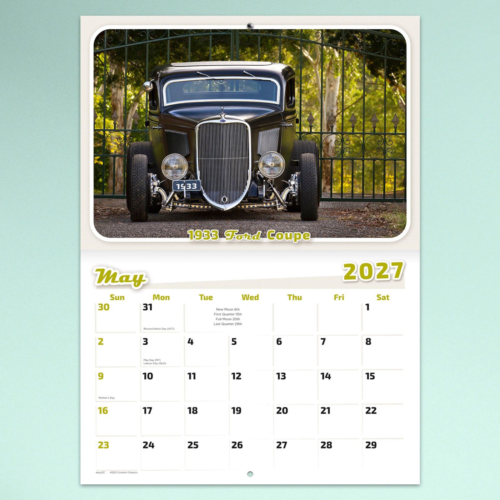 May page displaying a restored 1933 Ford Coupe positioned in front of decorative iron gates with a clear monthly planner beneath for organising events and important dates.