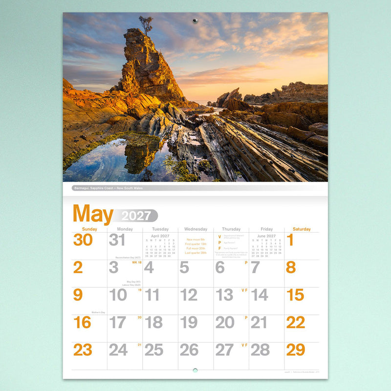 The May calendar page highlighting dramatic coastal rock formations at Bermagui on the Sapphire Coast in New South Wales with vibrant sunrise colours.